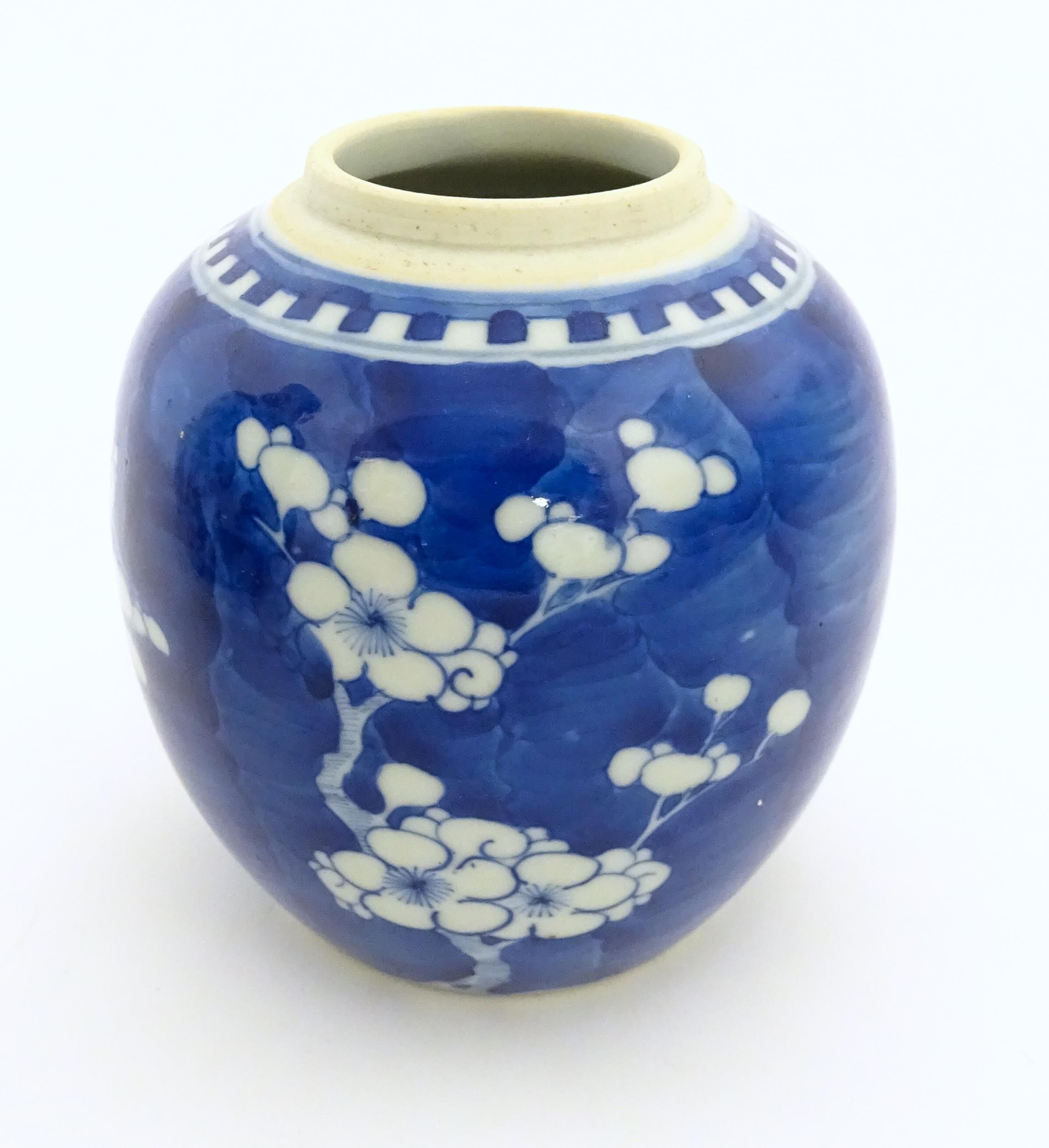 A Chinese blue and white jar decorated with prunus blossom. Character marks under. Approx. 5" high - Image 4 of 7
