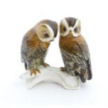 A Karl Ens bird group modelled as two owls perched on a branch. Marked under with no. 7751.