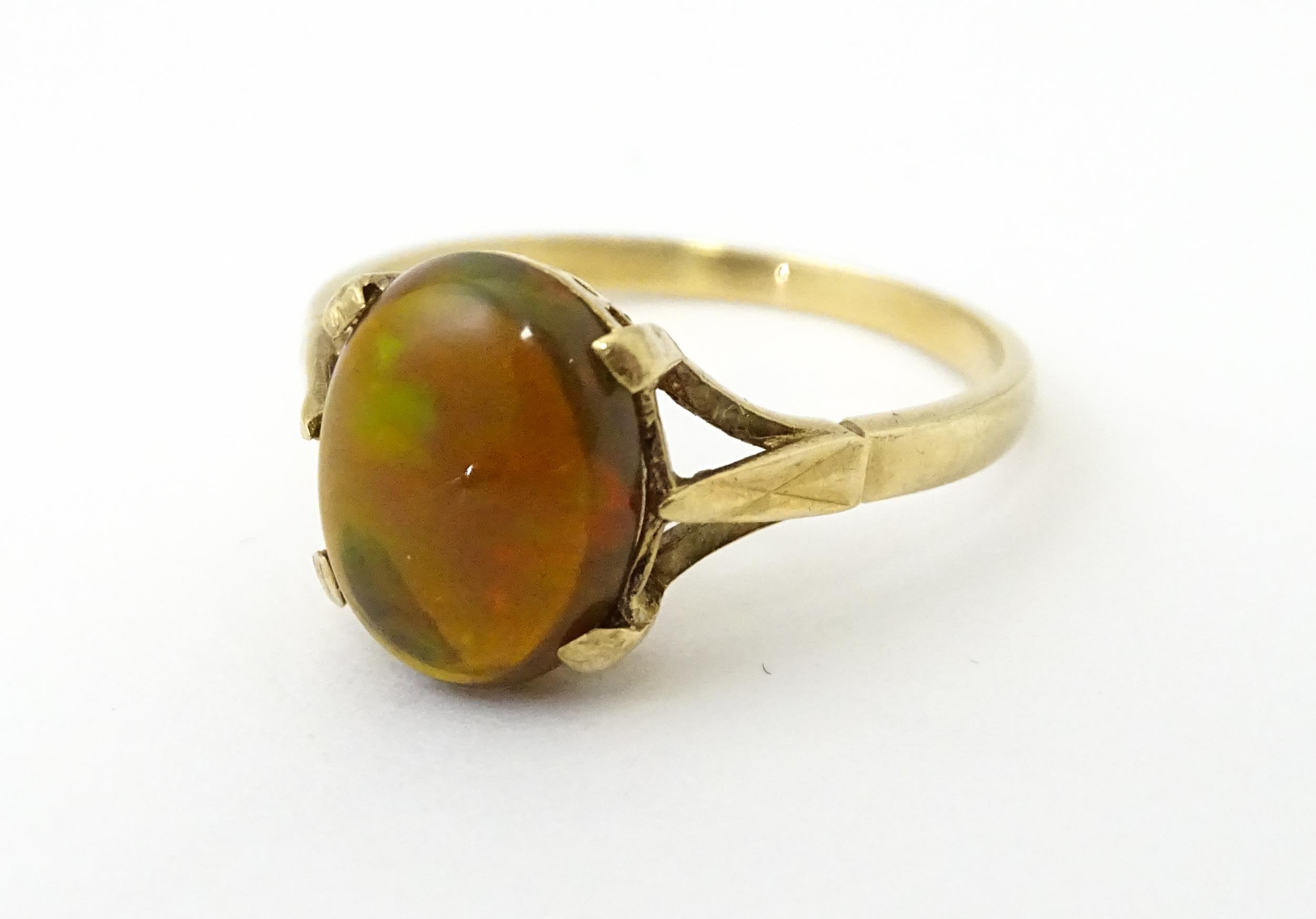 A 9ct gold ring set with fire opal cabochon. Ring size approx. R. Please Note - we do not make - Image 4 of 7