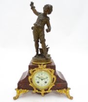 A French 8-day mantel clock striking on a bell, the rouge marble base housing a movement by A. D.
