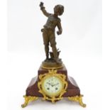 A French 8-day mantel clock striking on a bell, the rouge marble base housing a movement by A. D.