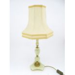 A 20thC table lamp with onyx style turned base. Approx. 18" high Please Note - we do not make