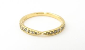 An 18ct gold Tiffany ring set with diamonds. Ring size approx M Please Note - we do not make