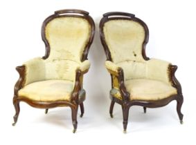 A pair of 19thC mahogany armchairs for re-upholstery, the chairs having spoon backs, manchettes