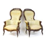 A pair of 19thC mahogany armchairs for re-upholstery, the chairs having spoon backs, manchettes