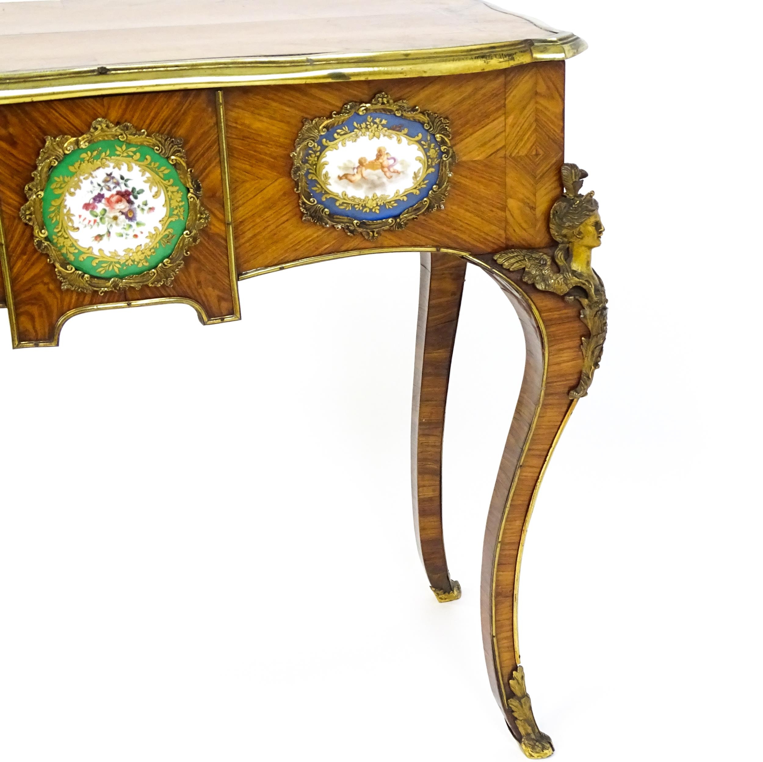 A mid 19thC kingwood side table with a brass moulding to the top edge and three Sevres style plaques - Image 5 of 14