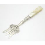 A Victorian silver bread fork with mother of pearl handle hallmarked Birmingham 1896, maker