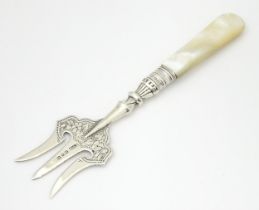 A Victorian silver bread fork with mother of pearl handle hallmarked Birmingham 1896, maker