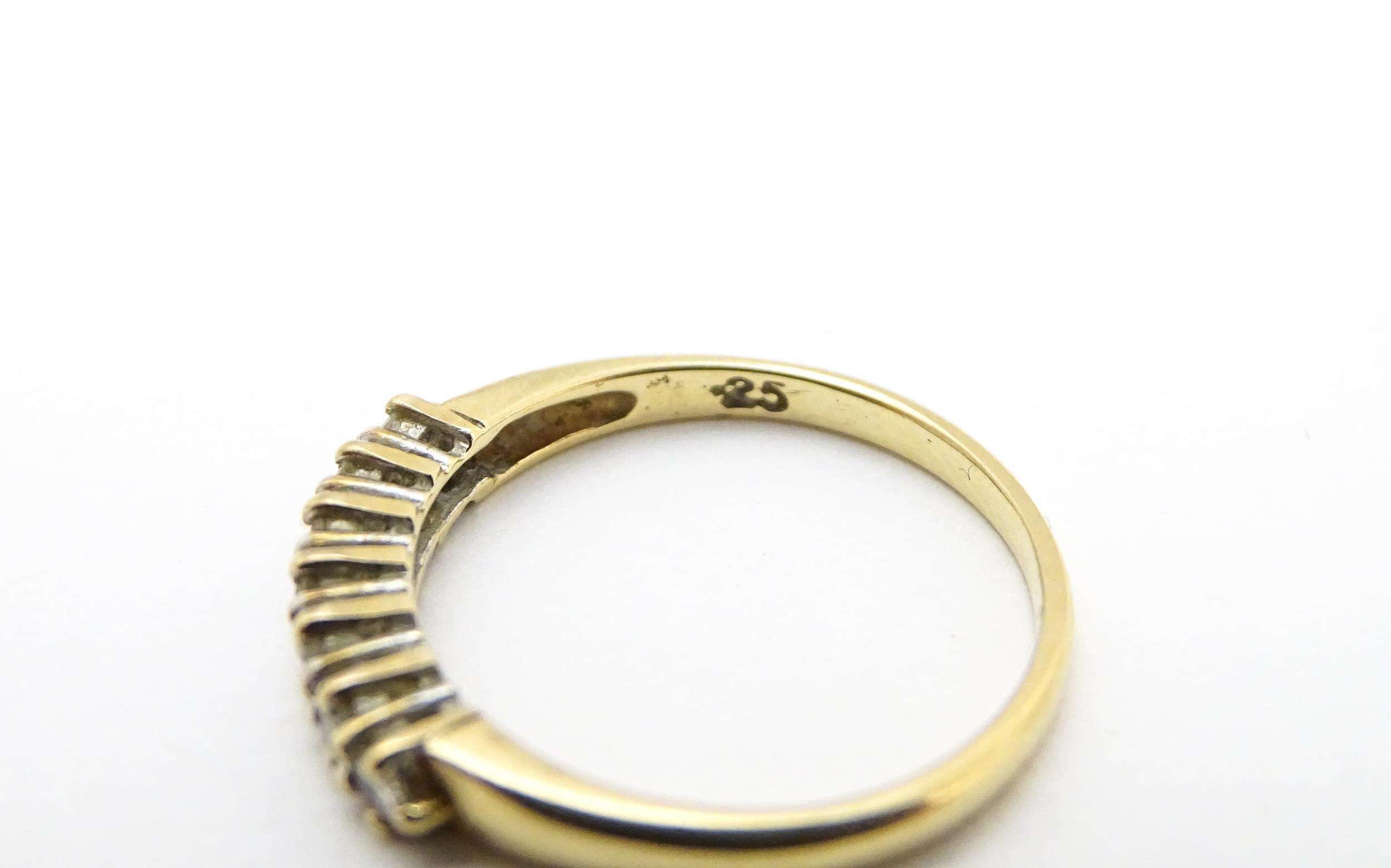 A 9ct gold ring set with seven diamonds in a linear setting. Ring size approx. K 1/2 Please Note - - Image 2 of 7