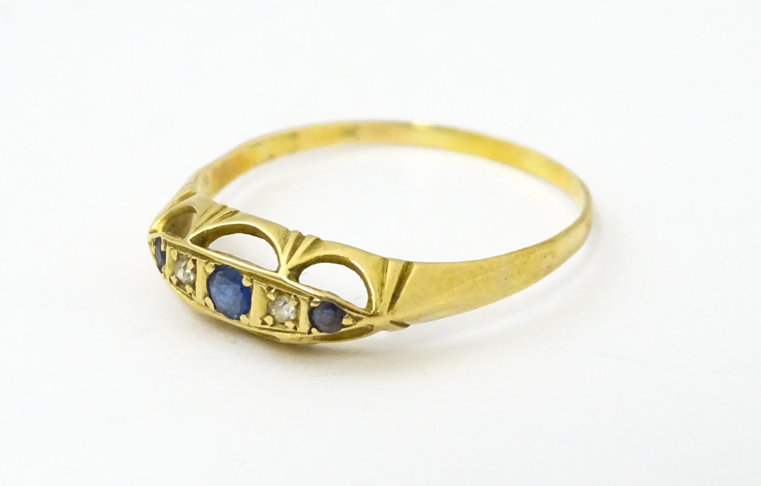 A gold ring set with diamonds and sapphires. Ring size approx. X Please Note - we do not make - Image 3 of 6