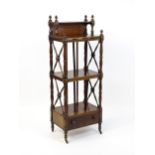 An early 19thC mahogany whatnot Canterbury surmounted by turned uprights and a small shelf above