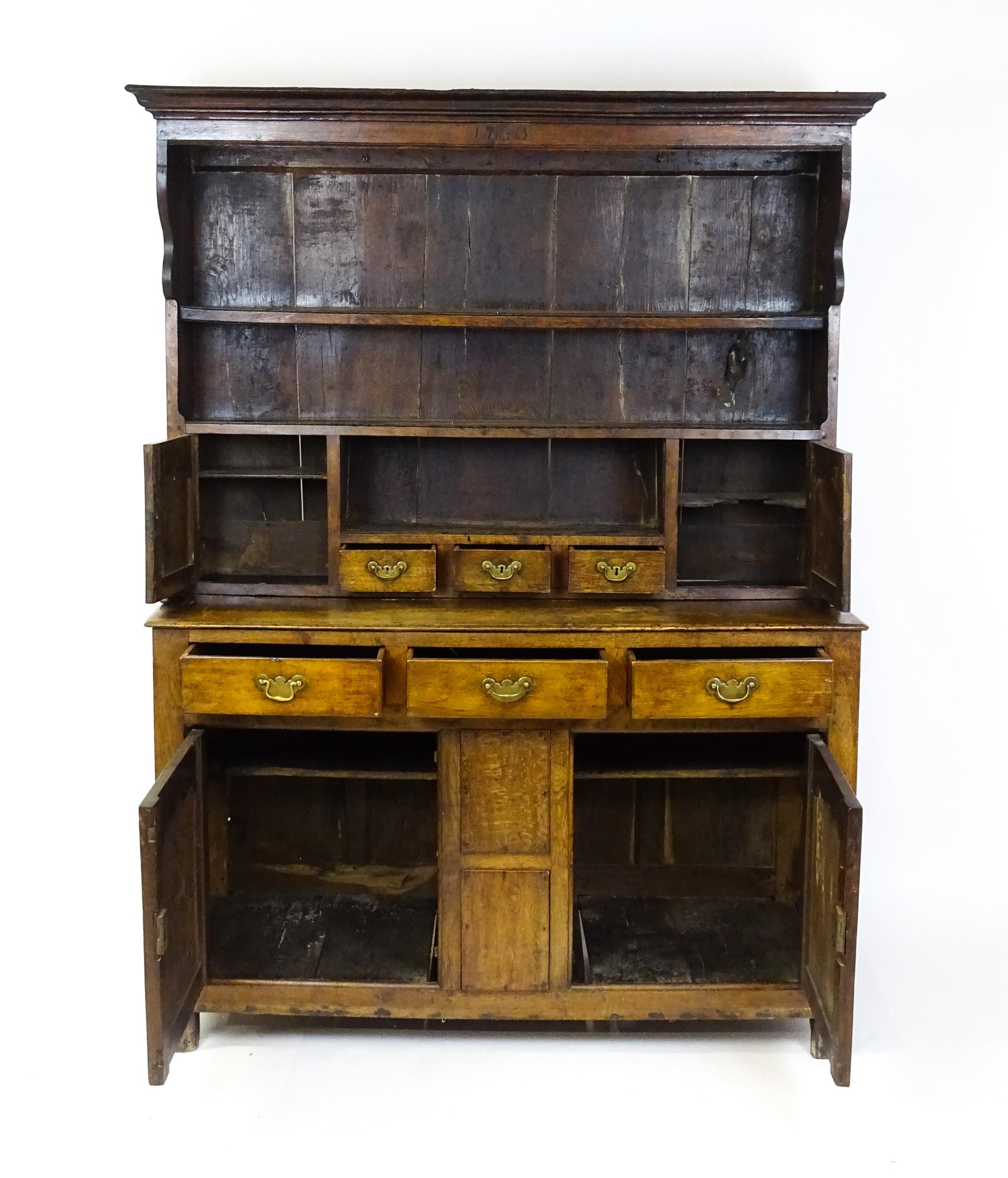 A mid 18thC oak dresser with a moulded cornice above three graduated shelves flanked by panelled - Image 8 of 9