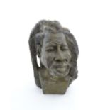 Ethnographic / Native / Tribal : An African carved soapstone bust modelled as a man with dreadlocks.