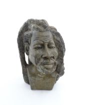 Ethnographic / Native / Tribal : An African carved soapstone bust modelled as a man with dreadlocks.