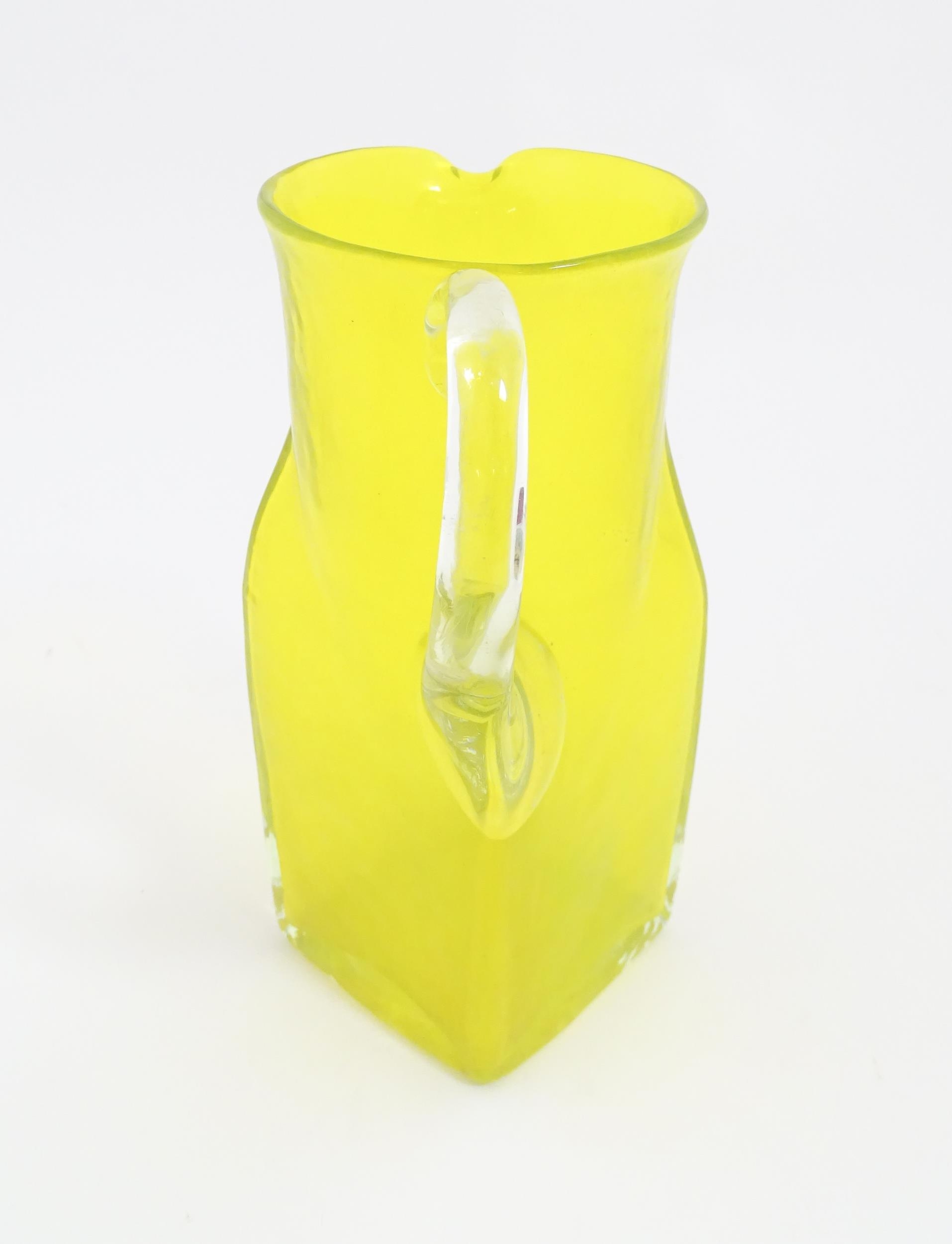 A 20thC yellow glass jug with squared base and clear glass handle. Approx. 8 1/2" high Please Note - - Image 7 of 11