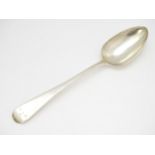 A Geo III silver table spoon hallmarked London 1810, maker Solomon Houghton. Approx. 9" long