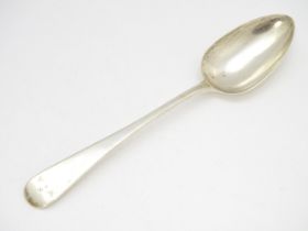 A Geo III silver table spoon hallmarked London 1810, maker Solomon Houghton. Approx. 9" long