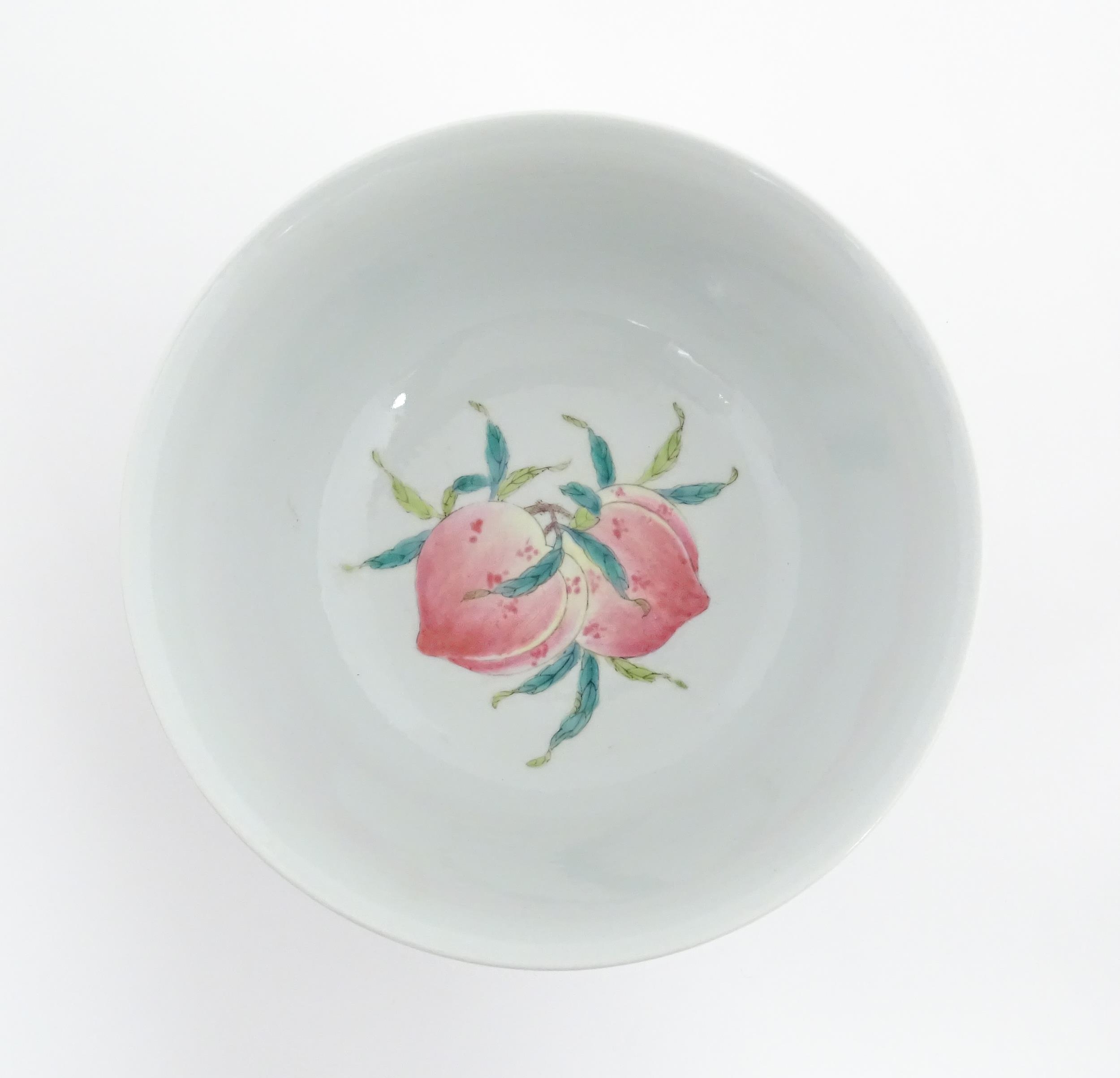 A Chinese bowl with banded foliate decoration to exterior and hand painted peached to interior. - Image 6 of 8