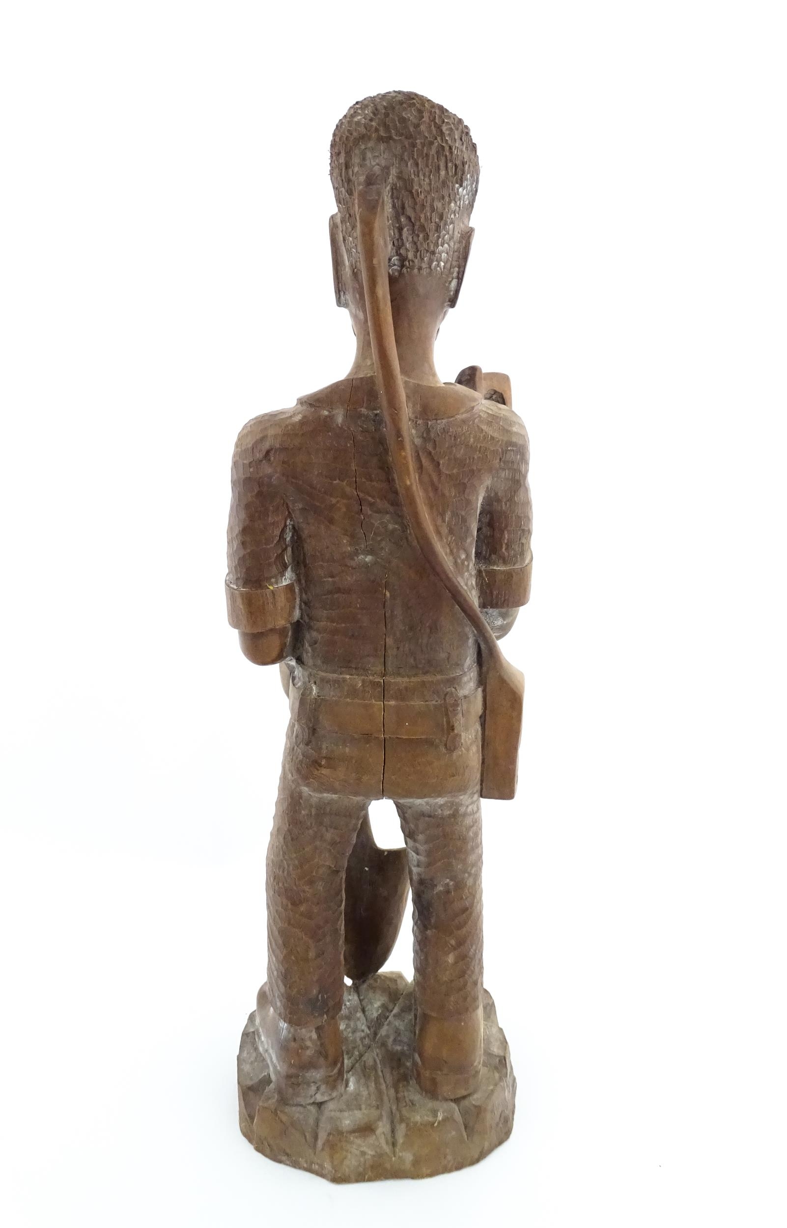 Ethnographic / Native / Tribal: An African carved wood figure modelled as a male farmer with a - Image 5 of 8