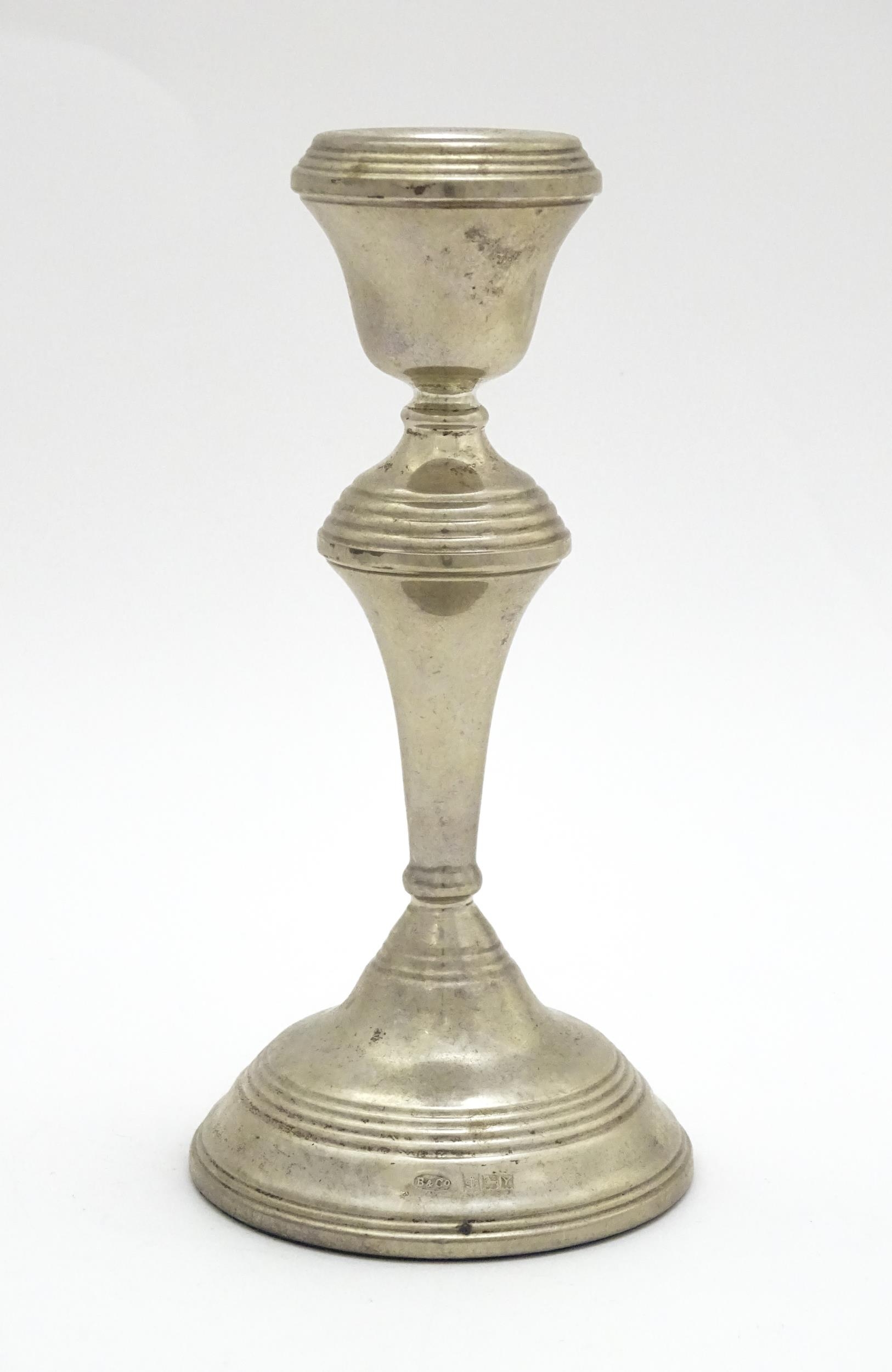 A silver candlestick hallmarked Birmingham 1973, maker W. I. Broadway. Approx. 7 1/4" high Please - Image 3 of 6