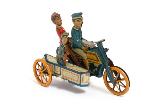 Toys: An early 20thC German tinplate motorcycle with sidecar, the blue, yellow and red motorbike - Image 2 of 9