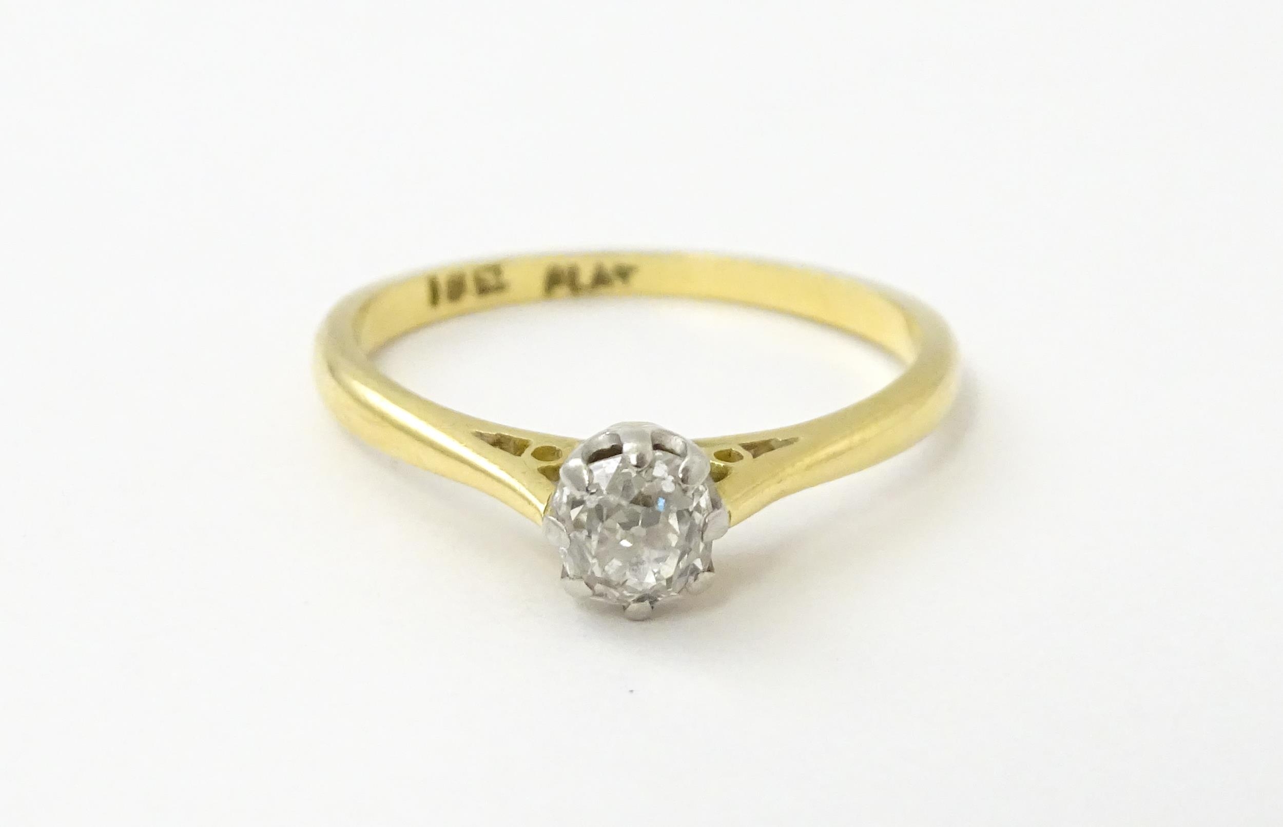 An 18ct gold diamond solitaire ring set in platinum. Ring size approx. N Please Note - we do not - Image 3 of 7