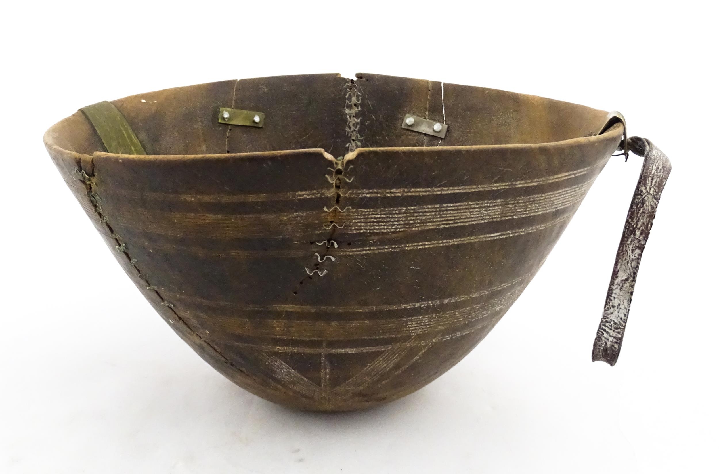 Ethnographic / Native / Tribal : An African Tuareg bowl with incised banded decoration. Approx. 9