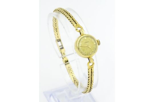 A ladies Omega gold plated wristwatch with 18ct gold bracelet strap. Approx. 1/2" wide (TW approx. - Image 8 of 12