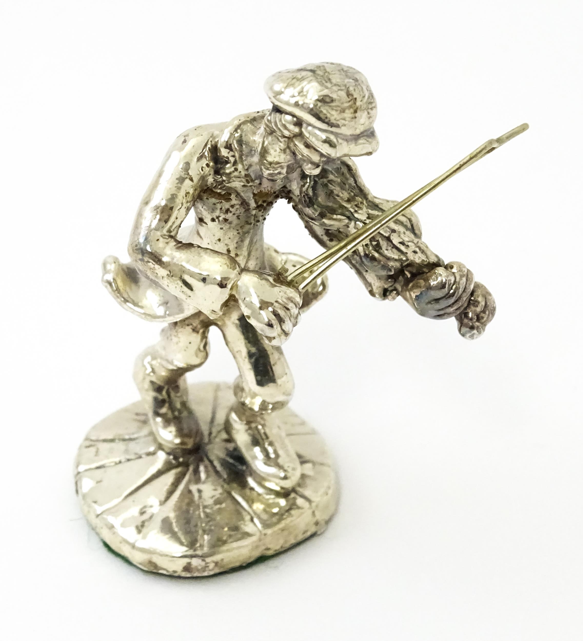 A white metal model of a man playing the fiddle in the manner of Ben Zion. Approx. 2 3/4" high - Image 8 of 8