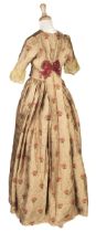 Clothing. A gold brocade dress, 1840s