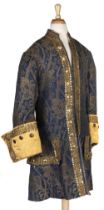 Theatre Costume. A brocade frock coat and matching breeches, late 19th/early 20th century, & others