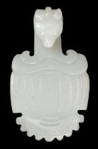 Jade. Chinese jade belt hook, carved with a beast's head hook