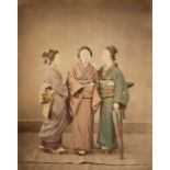 Japan. A group of 3 standing young women in traditional dress