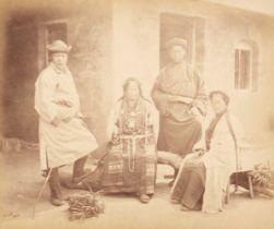 India. A group portrait of two Bhootea men and two women from the Himalayan region