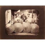 China. Courtyard with soldiers holding rattan shields and an official with his hand on his sword,