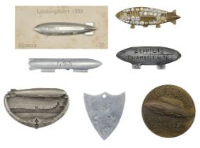 Airship Badges. R101 GFAAW commemorative brooch and Zeppelin badges