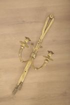 A POLISHED BRASS TWO SCONCE WALL LIGHT