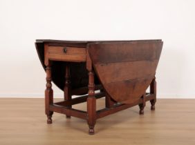 AN OAK DROP-LEAF TABLE