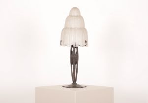 AN ART DECO LAMP WITH EDGAR BRANDT STYLE BASE