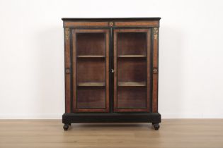 A VICTORIAN EBONISED AND WALNUT BOOKCASE