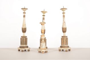 THREE ITALIAN WHITE-PAINTED AND PARCEL GILT PRICKET CANDLESTICKS