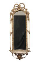 A CARVED AND GILDED RECTANGULAR MIRROR
