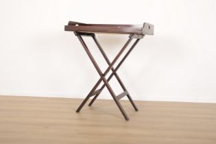 A MAHOGANY BUTLERS TRAY ON FOLDING STAND