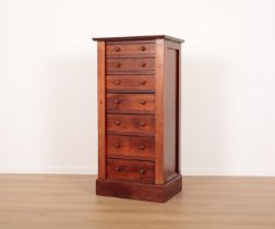 A MAHOGANY AND STAINED PINE WELLINGTON CHEST