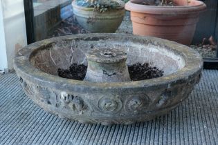 A CARVED STONE FOUNTAIN BASE OR PLANTER