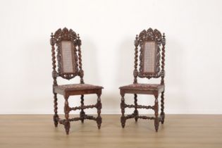 A PAIR OF CARVED OAK SIDE CHAIRS IN CAROLEAN STYLE