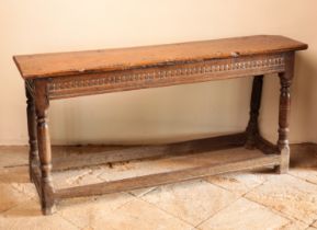 A CHARLES II OAK LONG STOOL