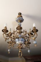 A CONTINENTAL BRASS AND "DELFTWARE" CHANDELIER