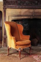 A QUEEN ANNE WALNUT WING ARMCHAIR