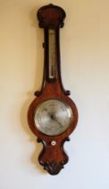 AN EARLY VICTORIAN ROSEWOOD "BANJO" BAROMETER